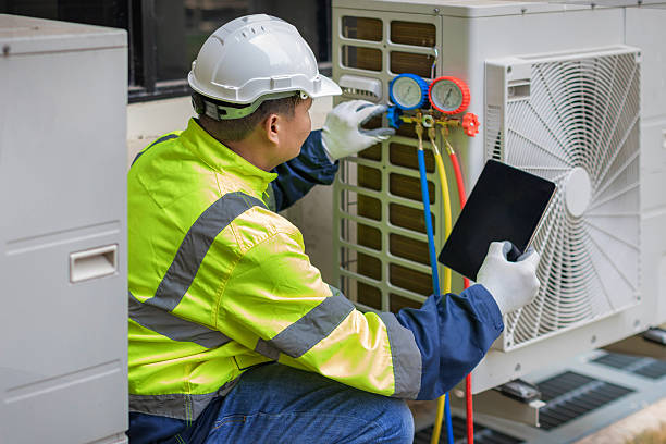 Professional Heat Pump Repair technician working in Tom Bean, TX